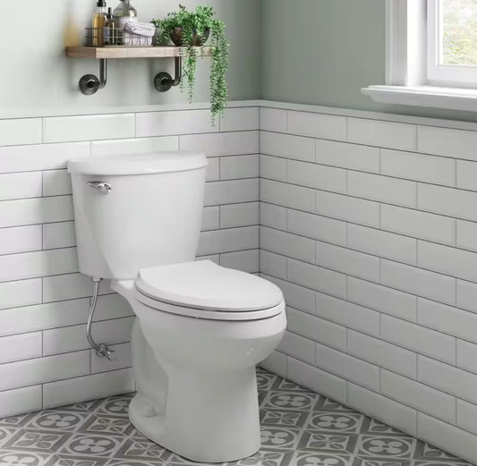 Reliant Two-Piece 1.28 GPF Single Flush Elongated Standard Height Toilet with Slow-Close Seat in White
